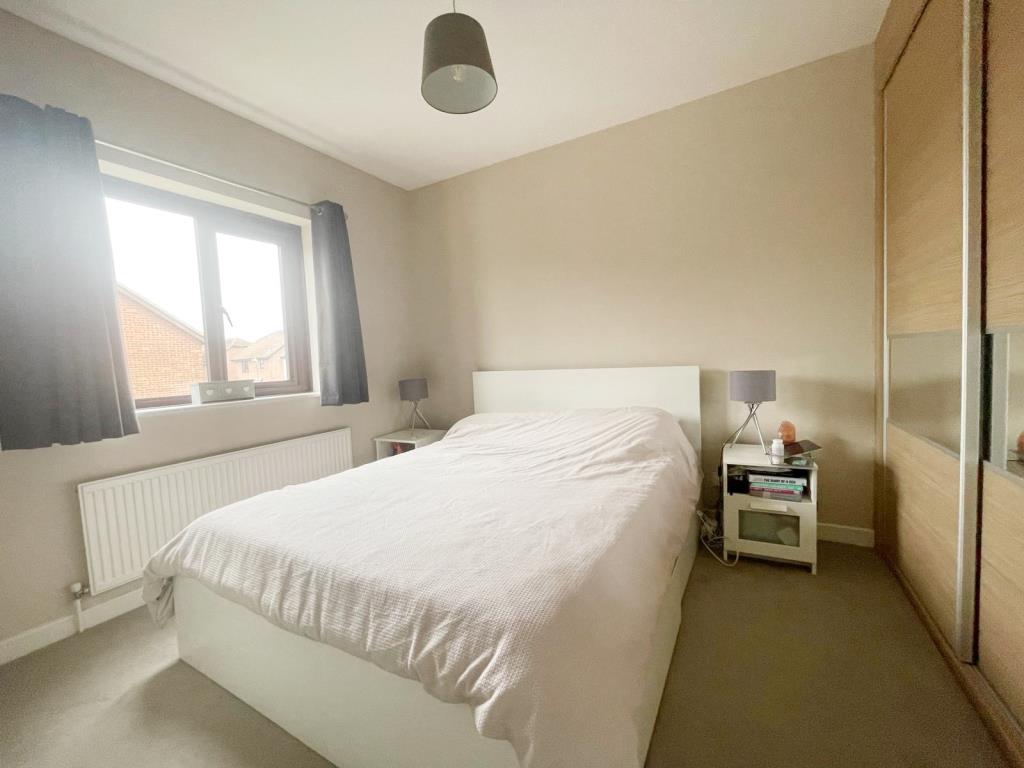 Lot: 4 - THREE-BEDROOM SEMI-DETACHED HOUSE FOR INVESTMENT - Bedroom one with fitted wardrobes